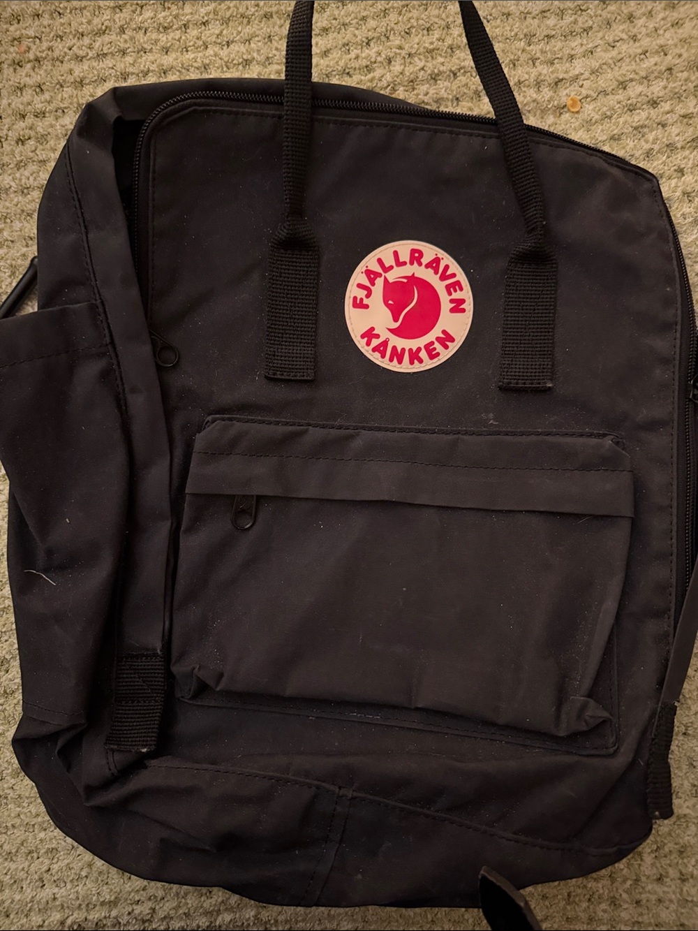 Fjallraven Kanken Black Backpack with red logo patch